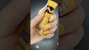 'Nude yellow super shine nail polish with multicolour glitter