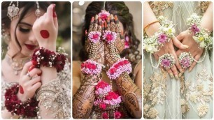 'Trendy Fashion Flower hand jewelry designs/hath phol gajra Design for mayon mehndi and sangeet bride'