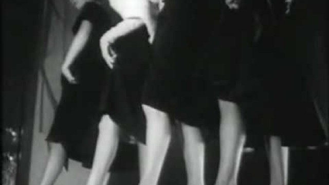 '1950 Catwalk show with glittering stockings/ nylons. Fashion for legs.'