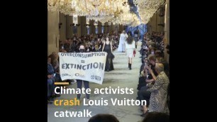 'Climate activists crash Louis Vuitton catwalk'